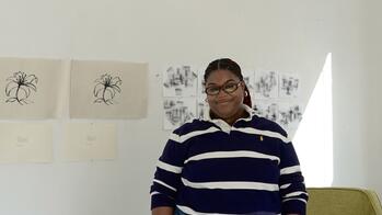 Headshot of Dominique Greene, Graduate Research Assistant at the Teaching & Learning Lab, RISD