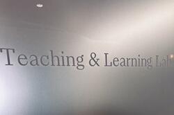 Door sign that reads: "Teaching & Learning Lab"