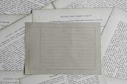 Image that shows blank postcard on top of book pages