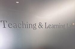 Door sign that reads: "Teaching & Learning Lab"